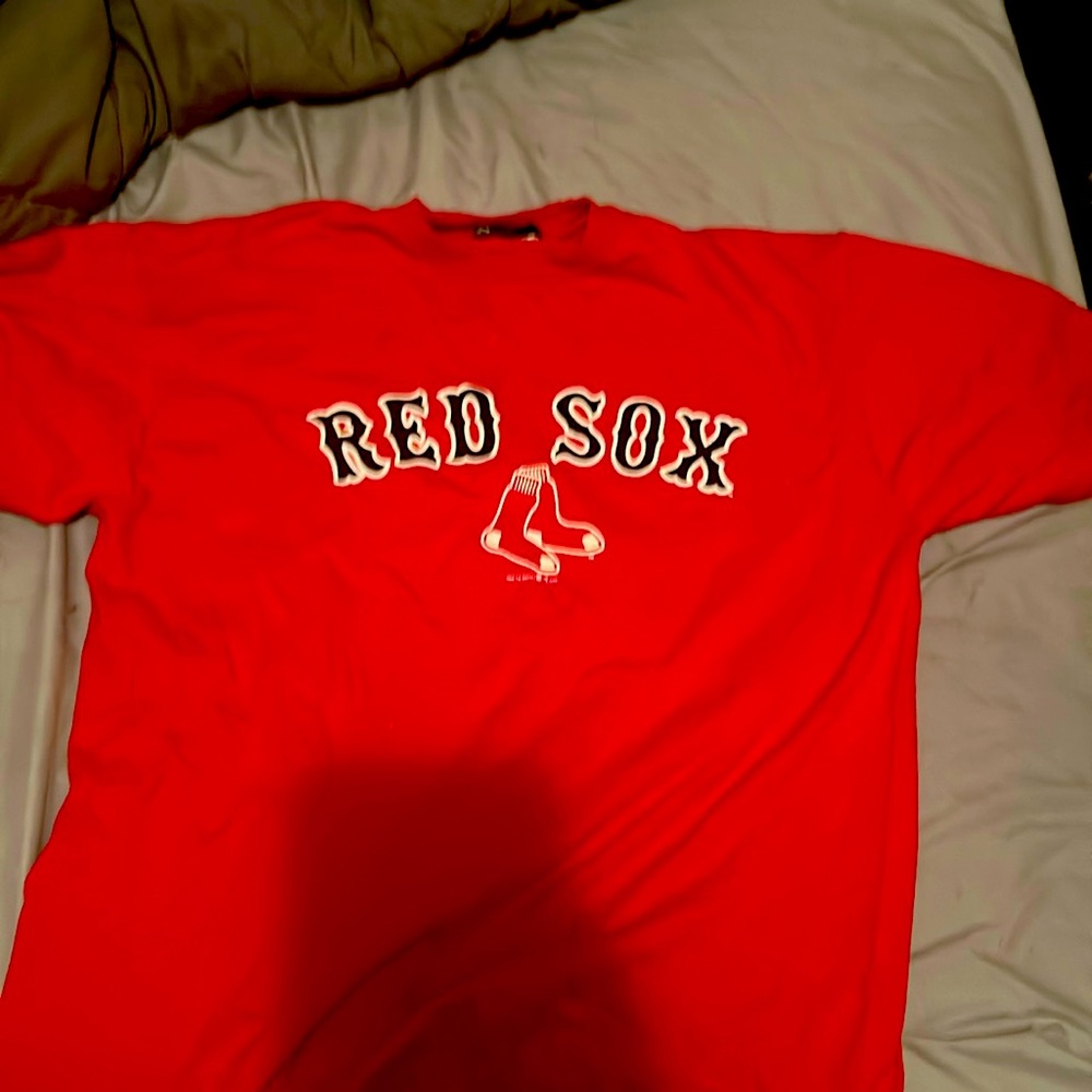 Red shirt says Red Sox